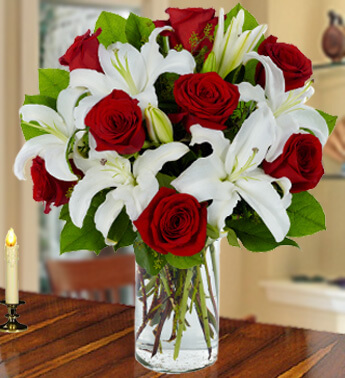 3 Stems of White Lilies & 8 Stems of Red Roses with fillers in a Glass Vase (one sided round arrangement) Red Ruby Bouquet