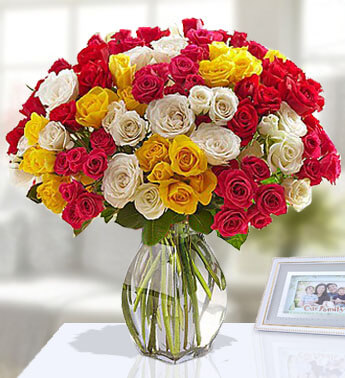 100 Red, Yellow and White Rose in a Glass Vase Attention Getter