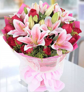 Bunch of 10 Red Roses, 4 stems of Pink Lilies with fillers in nice wrapping Posh Pinks